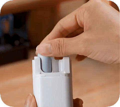 man cleaning its earbuds with thegeeky